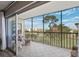 Spacious, screened balcony with outdoor seating offers golf course views, perfect for relaxing at 4240 Ironwood Cir # 404, Bradenton, FL 34209