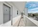 View of the condo balconies featuring white walls, and an exterior view of the community at 4240 Ironwood Cir # 404, Bradenton, FL 34209