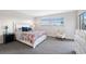 Bright bedroom offers a cozy bed with decorative pillows and ample natural light at 4240 Ironwood Cir # 404, Bradenton, FL 34209
