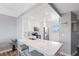 Bright kitchen boasts a breakfast bar with seating, modern stainless steel appliances and wood-look floors at 4240 Ironwood Cir # 404, Bradenton, FL 34209