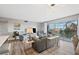Open living space leads to a cozy balcony through sliding doors, with neutral decor and comfortable seating at 4240 Ironwood Cir # 404, Bradenton, FL 34209