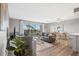 Inviting living room with sliding glass doors to the balcony that offers a lot of natural light at 4240 Ironwood Cir # 404, Bradenton, FL 34209