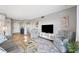 Well-lit living room with lots of seating, an entertainment center, and modern decor at 4240 Ironwood Cir # 404, Bradenton, FL 34209