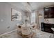 Dining area featuring an elegant chandelier, neutral décor, and modern finishes at 5030 Jagged Cloud Dr, Wimauma, FL 33598