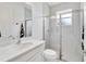 Bright bathroom featuring a marble vanity top, glass shower, and subway tile at 618 Manns Harbor Dr, Apollo Beach, FL 33572