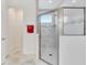 Bathroom with a glass enclosed shower featuring white subway tile with a decorative glass tile accent at 618 Manns Harbor Dr, Apollo Beach, FL 33572