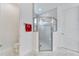 Bathroom with a glass enclosed shower featuring white subway tile with a decorative glass tile accent at 618 Manns Harbor Dr, Apollo Beach, FL 33572