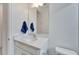 Clean bathroom with a white vanity, undermount sink, and modern fixtures at 618 Manns Harbor Dr, Apollo Beach, FL 33572
