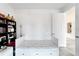 Well-lit bedroom featuring a daybed with built-in storage and an open doorway to a connected space at 618 Manns Harbor Dr, Apollo Beach, FL 33572