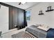 Stylish bedroom with dark board and batten accent wall, creating a modern and cozy atmosphere at 618 Manns Harbor Dr, Apollo Beach, FL 33572
