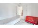 Bedroom with a daybed and extra storage beneath the bed; doorway view of another room's decor at 618 Manns Harbor Dr, Apollo Beach, FL 33572