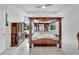A full view of the primary bedroom, including hardwood furnishings at 618 Manns Harbor Dr, Apollo Beach, FL 33572