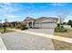 Welcoming home with ample parking, a well-kept lawn, and beautiful landscaping at 618 Manns Harbor Dr, Apollo Beach, FL 33572