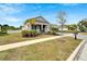 Attractive home with mature landscaping, green lawns, and a long driveway at 618 Manns Harbor Dr, Apollo Beach, FL 33572