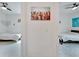 Hallway between two bedrooms separated by a colorful art piece at 618 Manns Harbor Dr, Apollo Beach, FL 33572