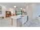 Open kitchen featuring a large island with seating and modern stainless-steel appliances at 618 Manns Harbor Dr, Apollo Beach, FL 33572