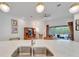 Kitchen island with stainless sink overlooking the living area and outdoor patio at 618 Manns Harbor Dr, Apollo Beach, FL 33572
