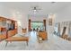 Well-lit living room with an entertainment center, leather sofa, and serene ambiance at 618 Manns Harbor Dr, Apollo Beach, FL 33572