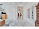 Open concept living room with pendant light and large format tile flooring at 618 Manns Harbor Dr, Apollo Beach, FL 33572