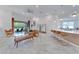 Spacious living room with modern decor, stylish furniture, and access to an outdoor patio at 618 Manns Harbor Dr, Apollo Beach, FL 33572