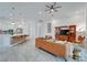 Bright living room featuring a leather sofa, entertainment center, and open flow at 618 Manns Harbor Dr, Apollo Beach, FL 33572