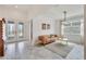 Bright living room with tile floors, modern lighting, and stylish furniture, creating an inviting and airy space at 618 Manns Harbor Dr, Apollo Beach, FL 33572
