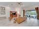 Inviting living room with stylish furniture, neutral tones, and access to the patio at 618 Manns Harbor Dr, Apollo Beach, FL 33572