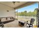 Inviting screened patio with comfortable seating, perfect for relaxing and enjoying the outdoors at 618 Manns Harbor Dr, Apollo Beach, FL 33572