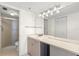 Bathroom featuring a gray vanity, modern lighting, and a glass-enclosed shower at 6322 Palma Del Mar S Blvd # 506, St Petersburg, FL 33715