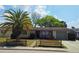 Charming single-story home with stone accents, a well-manicured lawn, and an attached one car garage at 6840 Mesa Verde St, Port Richey, FL 34668