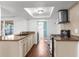 Well-lit kitchen featuring stainless steel appliances, tile backsplash, and a double sink at 6840 Mesa Verde St, Port Richey, FL 34668