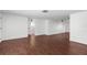 Spacious living room features beautiful wood floors and neutral wall colors at 6840 Mesa Verde St, Port Richey, FL 34668