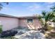 Outdoor patio area with landscaping and a palm tree at 6840 Mesa Verde St, Port Richey, FL 34668