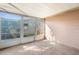 Enclosed sunroom featuring large windows and natural light at 6840 Mesa Verde St, Port Richey, FL 34668