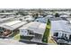 Aerial view of a well maintained single Gathering home with carport in a quiet community at 7133 El Matador St, Zephyrhills, FL 33541