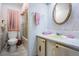Bathroom with a shower, pink accents, and a marble countertop at 7133 El Matador St, Zephyrhills, FL 33541