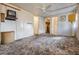 Spacious bedroom with a ceiling fan, wood paneled walls, and an attached closet at 7133 El Matador St, Zephyrhills, FL 33541