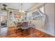 Charming dining area bathed in natural light, perfect for enjoying meals and entertaining guests at 7133 El Matador St, Zephyrhills, FL 33541