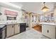 Spacious kitchen featuring built-in cabinetry, a breakfast bar, and an adjacent dining area at 7133 El Matador St, Zephyrhills, FL 33541