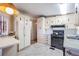 Well-lit kitchen with ample storage, updated appliances, and breakfast bar; perfect for casual dining at 7133 El Matador St, Zephyrhills, FL 33541