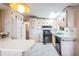 Traditional-style kitchen features ample cabinet space, modern appliances, and an adjacent breakfast nook at 7133 El Matador St, Zephyrhills, FL 33541