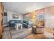 Cozy living room features comfortable seating, natural light, and a decorative area rug at 7133 El Matador St, Zephyrhills, FL 33541
