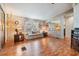 Relaxing living room featuring laminate wood floors, bright natural light, and comfortable seating at 7133 El Matador St, Zephyrhills, FL 33541
