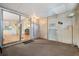 Enclosed sunroom featuring a sliding glass door and a standing lamp at 7133 El Matador St, Zephyrhills, FL 33541