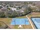 Aerial view of community basketball courts and tennis courts; community recreational area at 8414 Eagle Brook Dr, Land O Lakes, FL 34638
