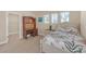 Cozy bedroom features a built-in desk, soft carpet, and windows with natural light at 8414 Eagle Brook Dr, Land O Lakes, FL 34638