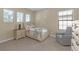 Cozy bedroom featuring a twin-sized bed, a nightstand, a chair, and carpet flooring at 8414 Eagle Brook Dr, Land O Lakes, FL 34638