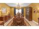 Charming dining room features a chandelier, elegant buffet, and a decorative rug, ideal for Gathering dinners at 8414 Eagle Brook Dr, Land O Lakes, FL 34638