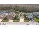 Street view showcases the home with mature landscaping and a three-car garage at 8414 Eagle Brook Dr, Land O Lakes, FL 34638