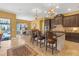 Spacious kitchen features an island, dining area, stainless steel appliances, and custom cabinetry at 8414 Eagle Brook Dr, Land O Lakes, FL 34638